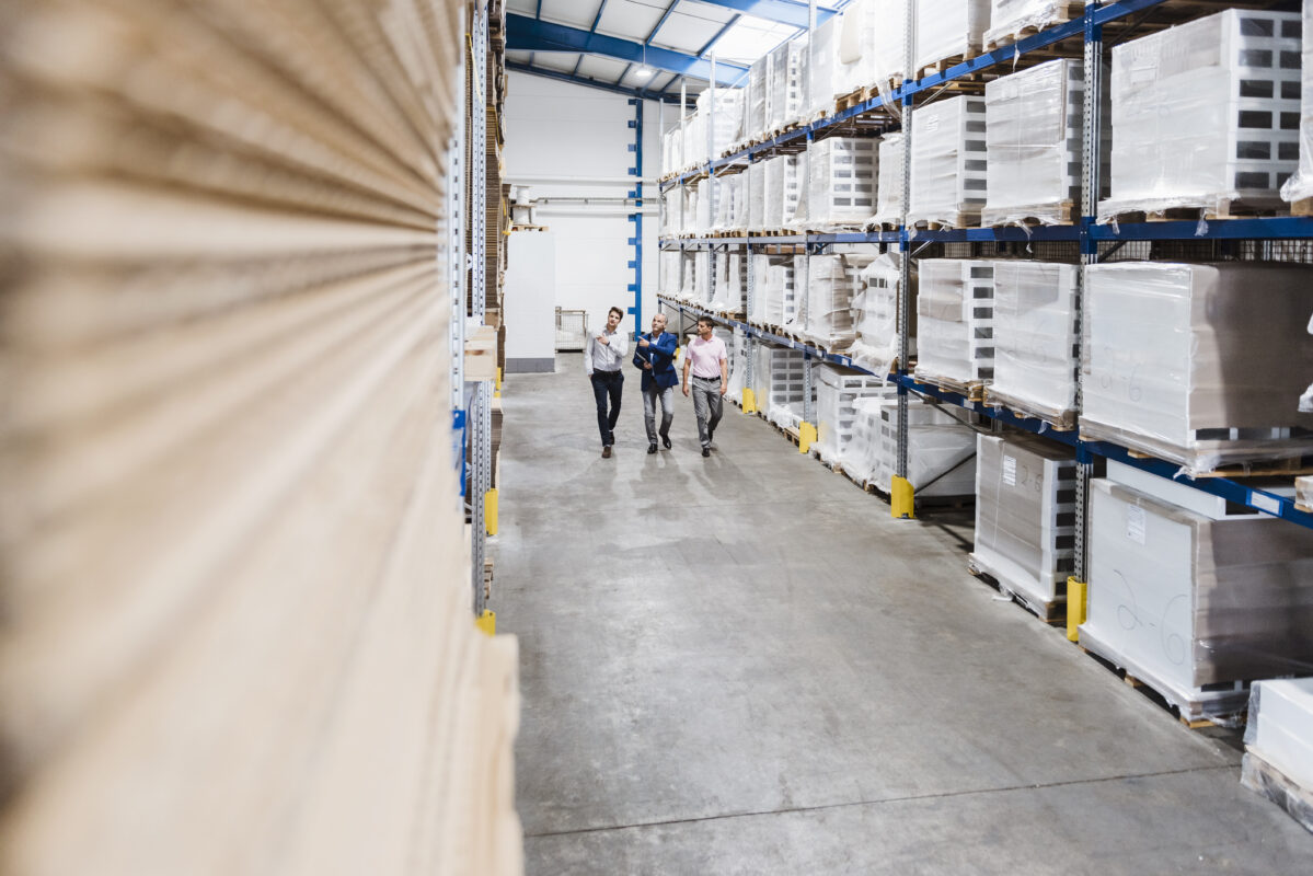 Business people meeting in company storehouse